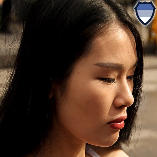 A Thai woman with a blank expression