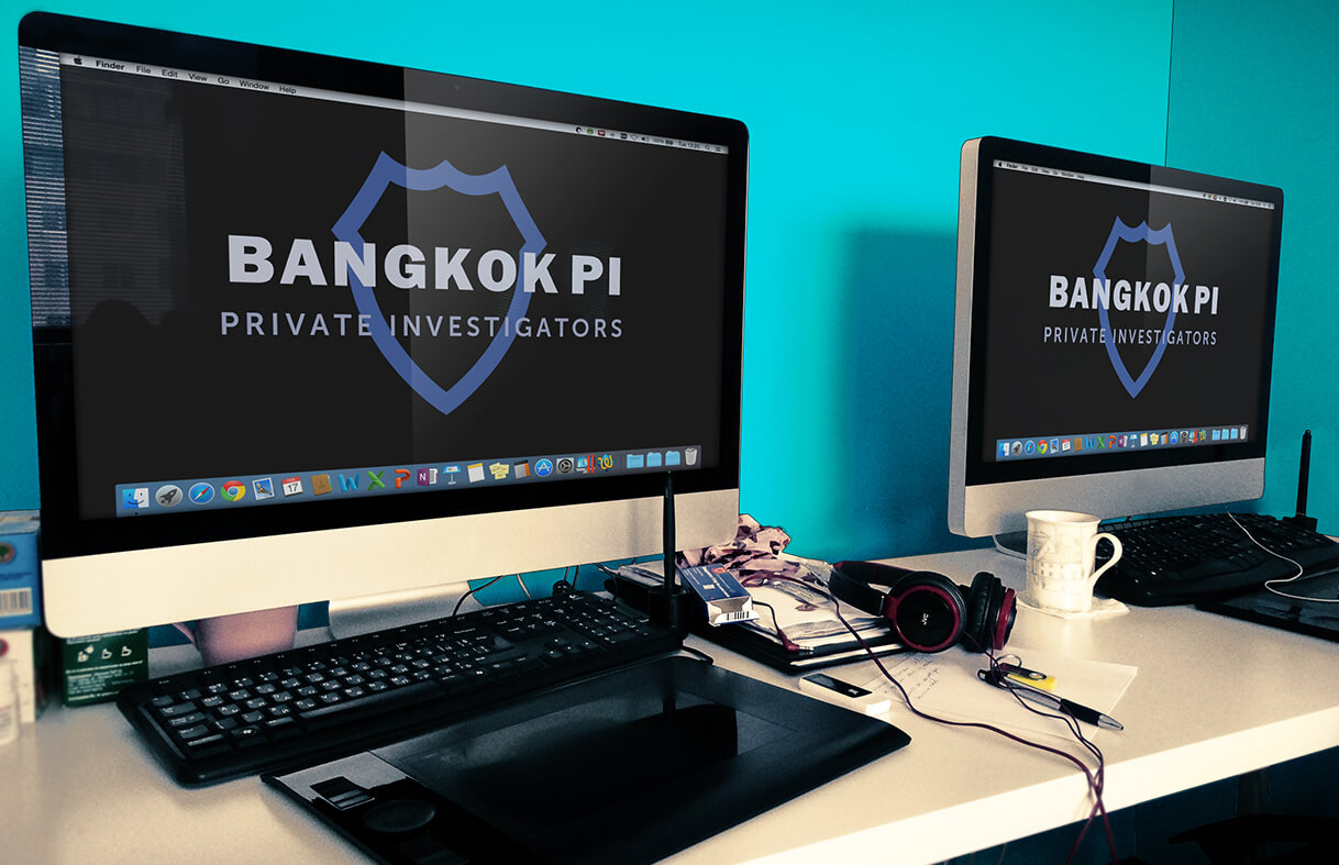 Two computer screens displaying the Bangkok Private Investigators logo