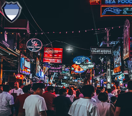 People walking on a busy street in Thailand at night