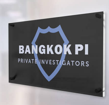 Bangkok Private Investigators logo on a wall