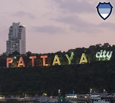The sign for Pattaya Thailand illuminated at night