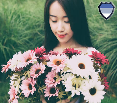 Asian lady holding flowers