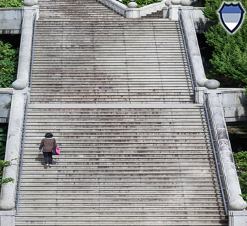 Person walking up stone stairs