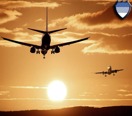 Planes taking off and landing during sunset