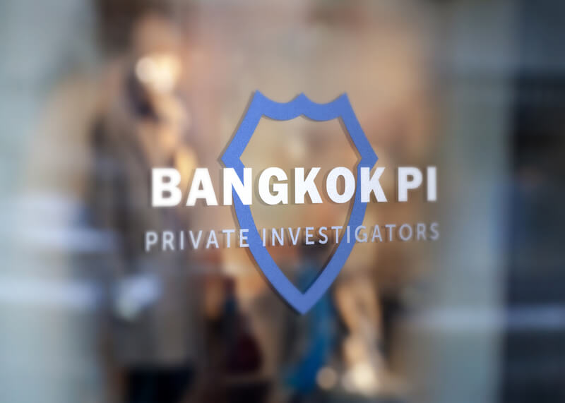 Bangkok Private Investigators logo on a glass door