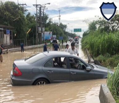 Car stuck on a flooded road in Thailand
