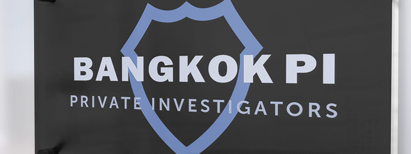 Bangkok Private Investigators logo on a black plaque