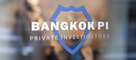 Bangkok private investigations logo on an office wall